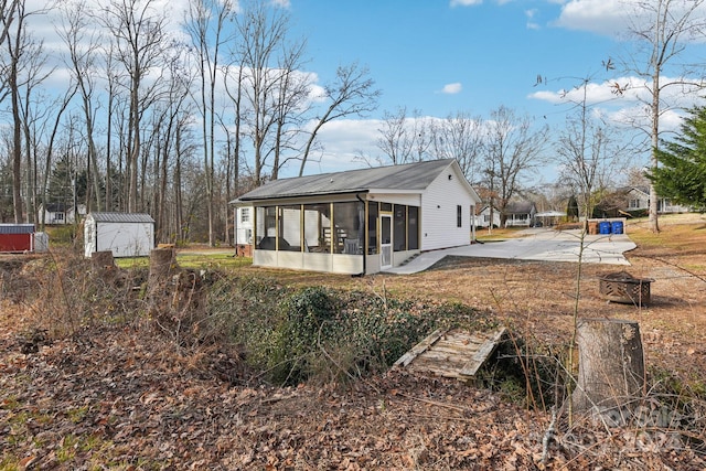 exterior space featuring a sunroom