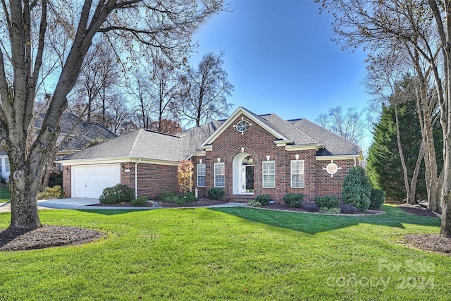 view of front facade with a garage and a front yard