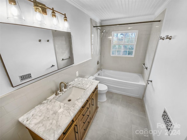 full bathroom with vanity, toilet, crown molding, and tiled shower / bath