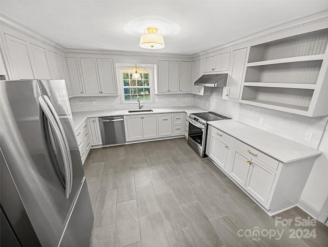 kitchen with stainless steel appliances, white cabinetry, and sink