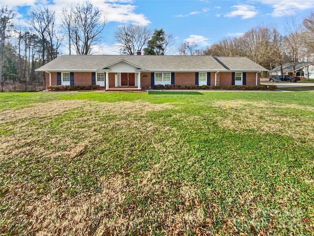 single story home featuring a front yard