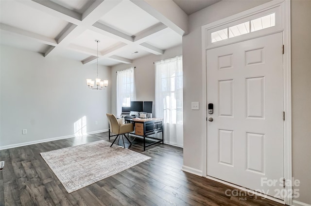 foyer entrance with beamed ceiling, dark hardwood / wood-style floors, a chandelier, and coffered ceiling