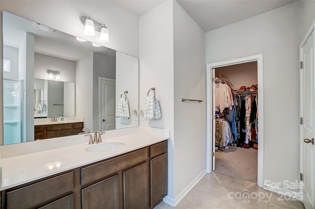 bathroom featuring tile patterned flooring and vanity