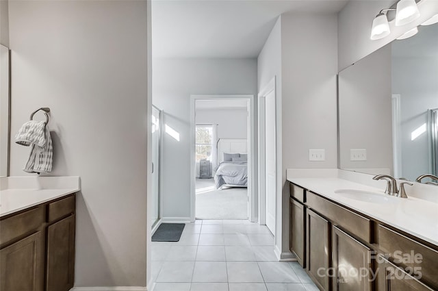 bathroom with tile patterned floors and vanity