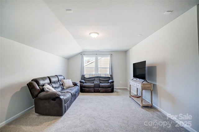 carpeted living room with vaulted ceiling