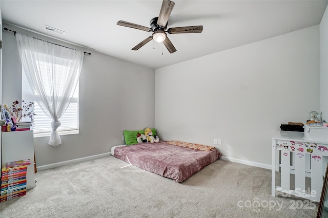 carpeted bedroom with ceiling fan