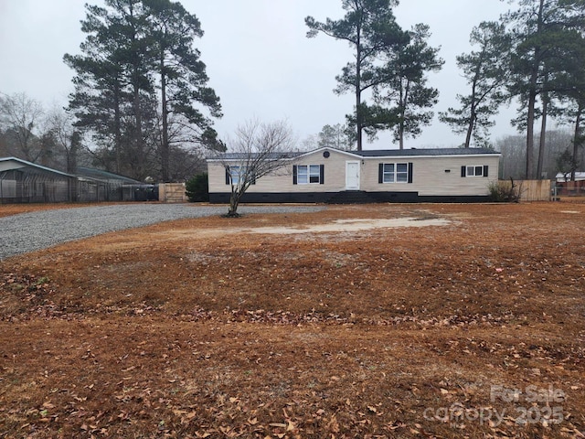 manufactured / mobile home with crawl space and fence