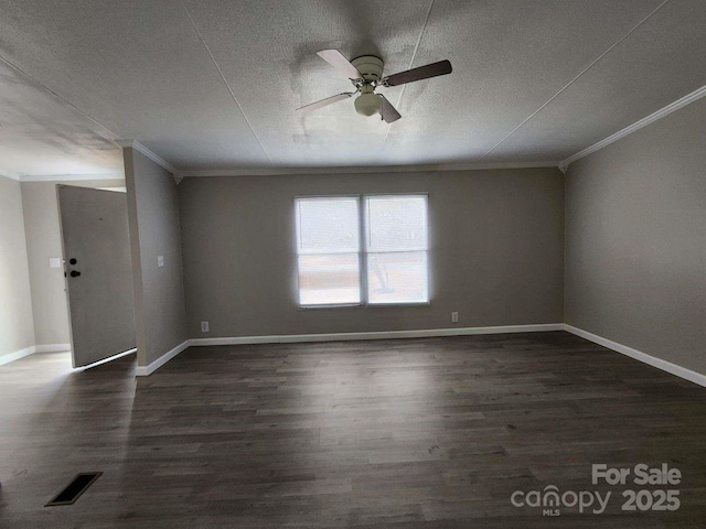 spare room featuring crown molding, a ceiling fan, and dark wood-style floors