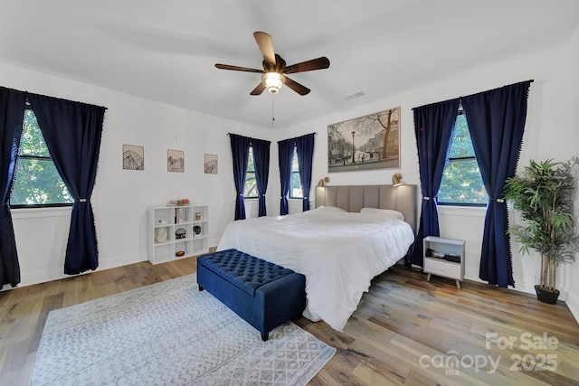 bedroom featuring ceiling fan and wood-type flooring