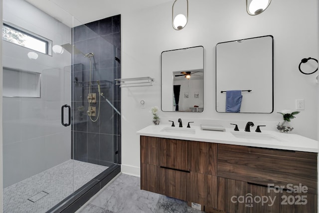 bathroom with ceiling fan, walk in shower, and vanity