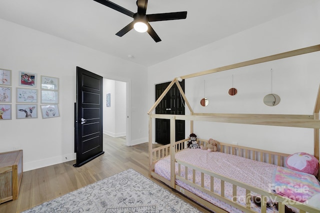 bedroom featuring ceiling fan and light wood-type flooring