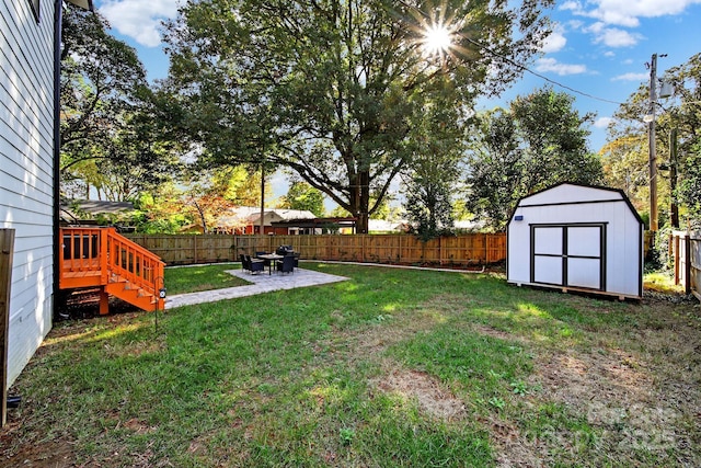 view of yard with a patio area and a shed