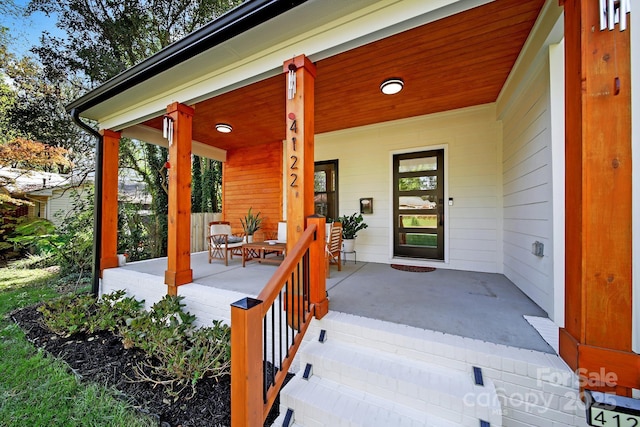 doorway to property featuring covered porch