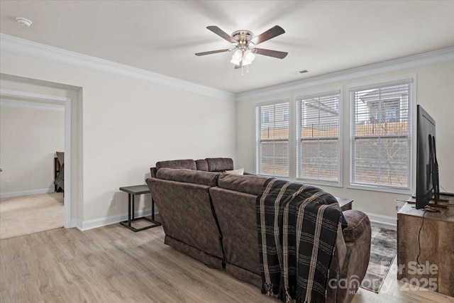 living room with ceiling fan, light hardwood / wood-style flooring, and ornamental molding