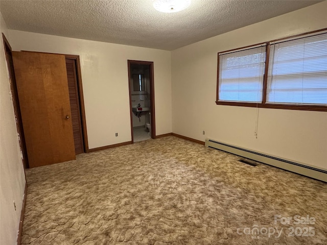 unfurnished bedroom featuring baseboard heating, light colored carpet, and a textured ceiling