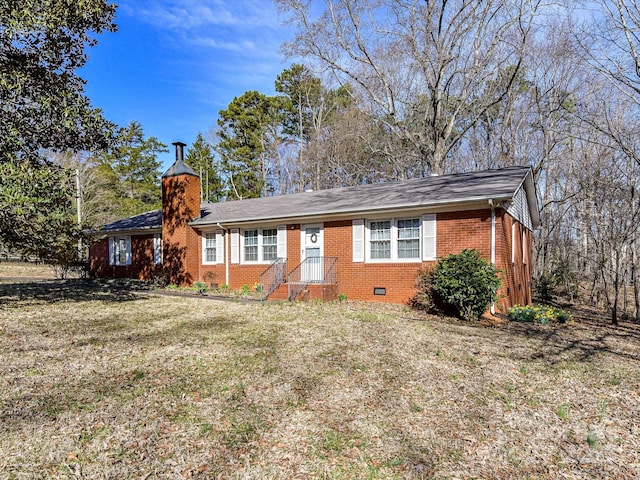 single story home featuring crawl space, a chimney, a front lawn, and brick siding