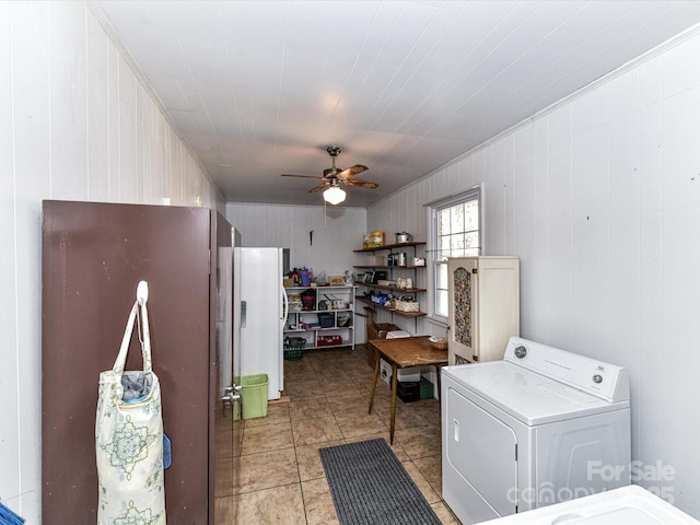 laundry room featuring light tile patterned floors, laundry area, washer / clothes dryer, and ceiling fan