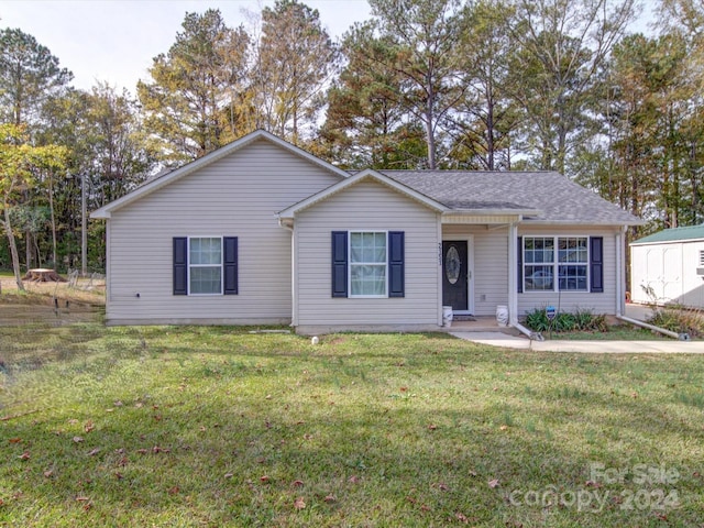 ranch-style home with a front yard