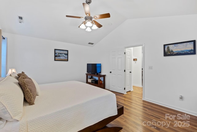 bedroom with hardwood / wood-style floors, ceiling fan, and lofted ceiling