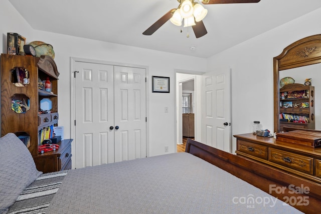 bedroom featuring ceiling fan and a closet