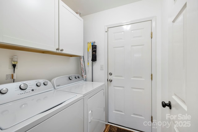 clothes washing area featuring cabinets and washing machine and clothes dryer