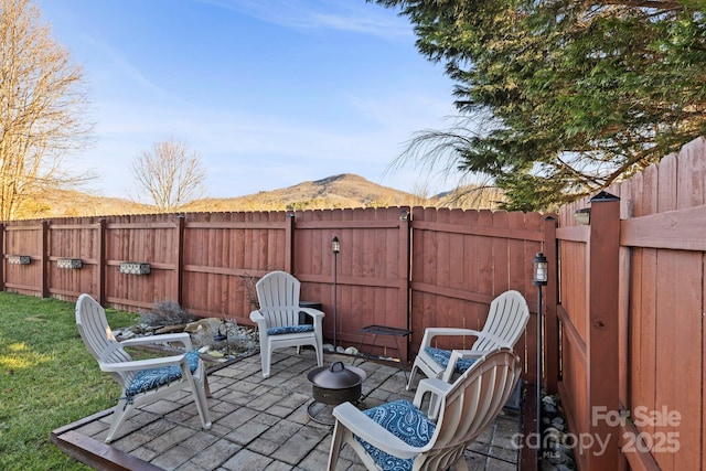 view of patio / terrace with a mountain view