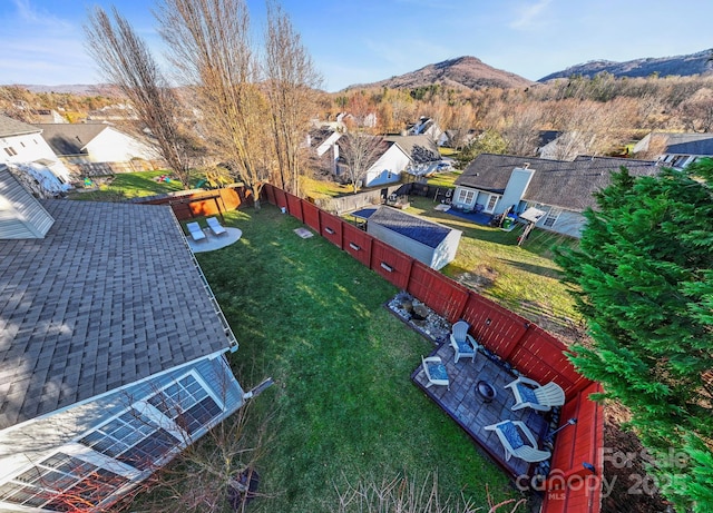 birds eye view of property with a mountain view