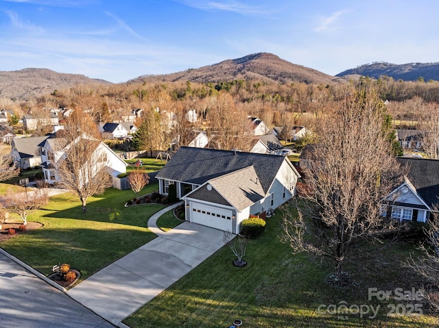 birds eye view of property with a mountain view