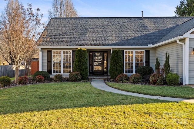 single story home with a front yard