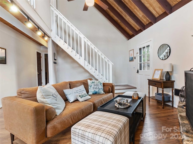 living room featuring beamed ceiling, ceiling fan, dark hardwood / wood-style flooring, and high vaulted ceiling