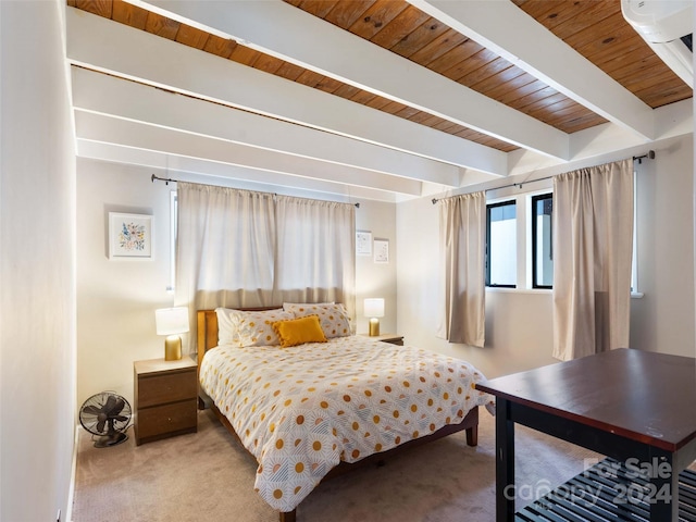 carpeted bedroom with beam ceiling and wood ceiling