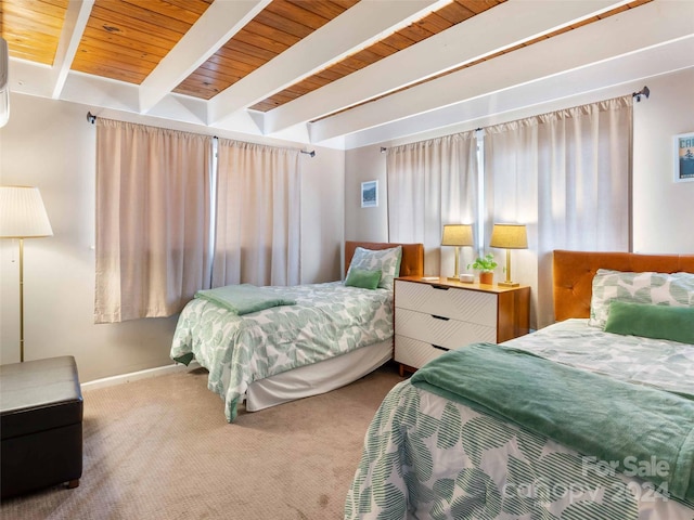 bedroom with beamed ceiling, carpet, and wood ceiling