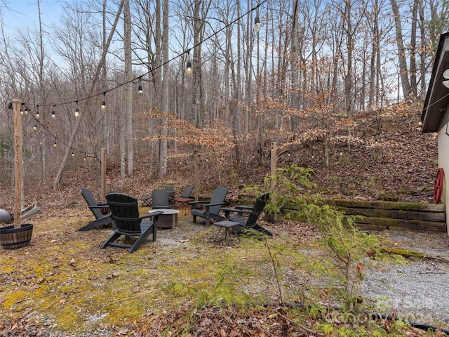 view of yard with a fire pit