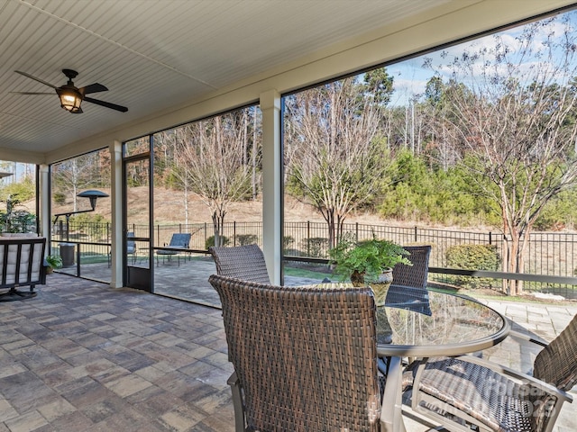 sunroom / solarium with ceiling fan