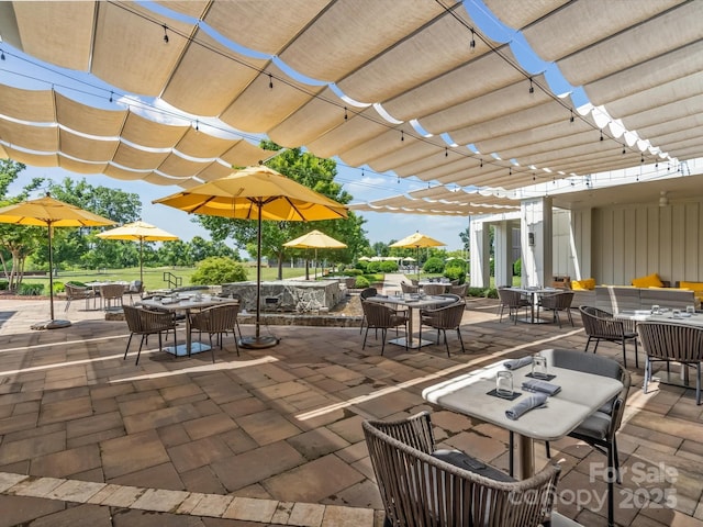 view of patio / terrace featuring a pergola and outdoor lounge area