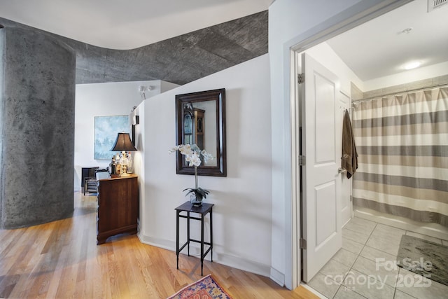 corridor featuring light hardwood / wood-style flooring