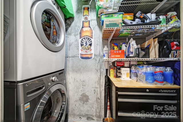 laundry room with stacked washer and clothes dryer