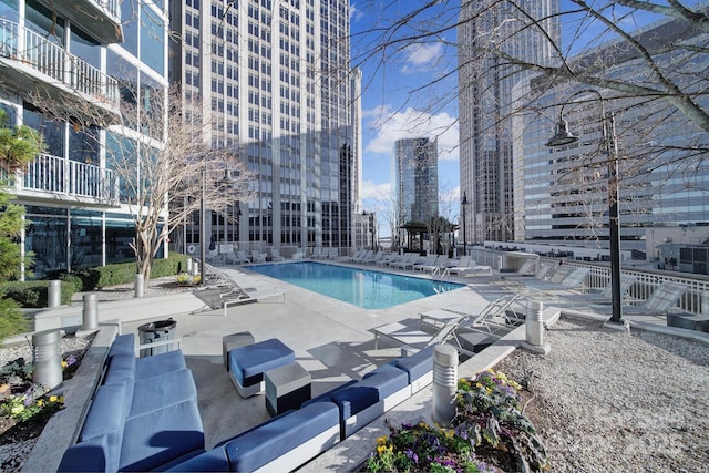 view of swimming pool featuring a patio area