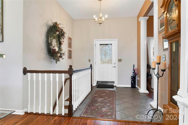 tiled foyer entrance featuring a chandelier