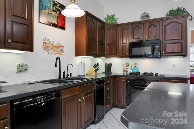 kitchen with black appliances, decorative backsplash, light tile patterned flooring, and sink