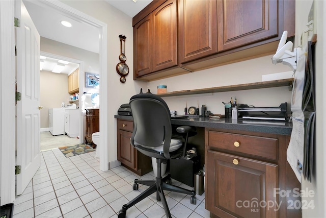 office with washing machine and dryer and light tile patterned floors