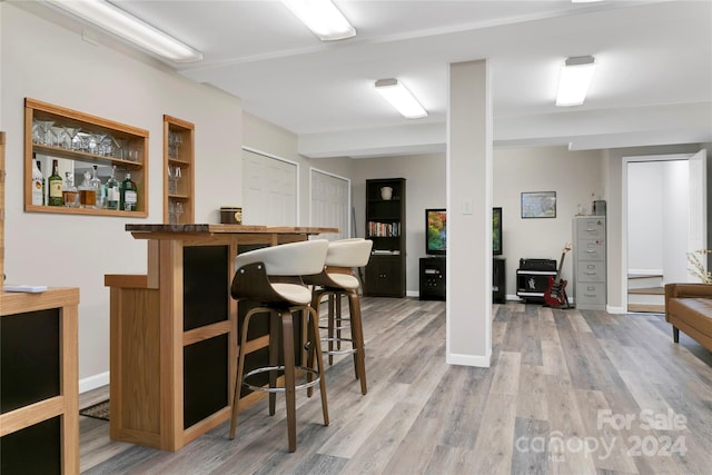 bar featuring wood-type flooring