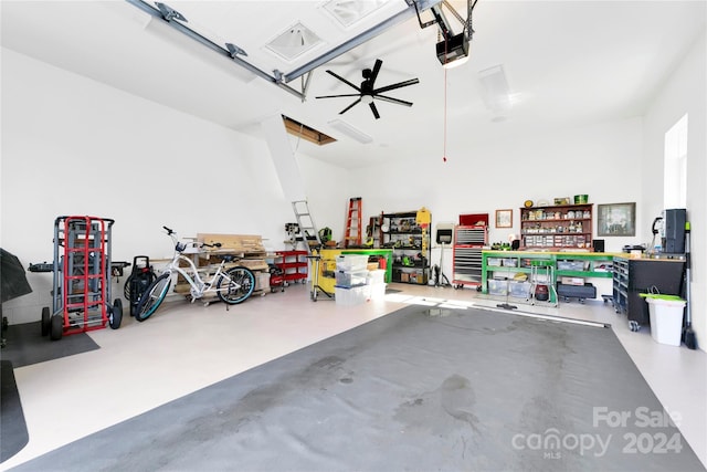 garage with a workshop area, ceiling fan, and a garage door opener