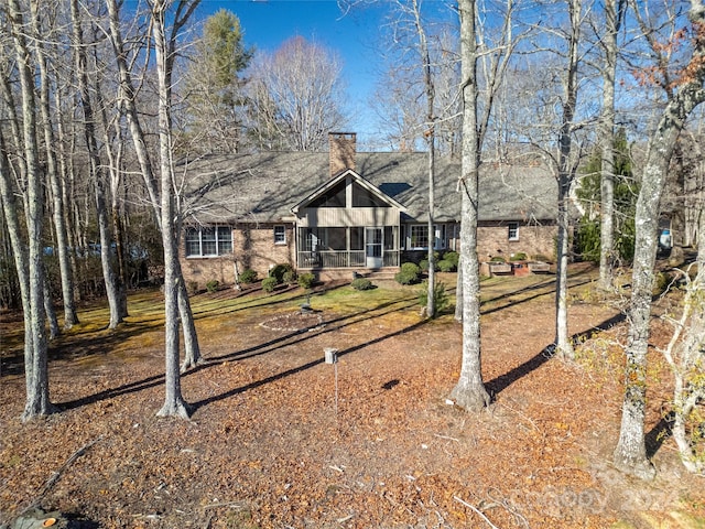 view of front facade with a sunroom