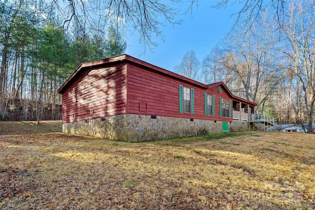 view of home's exterior with a lawn