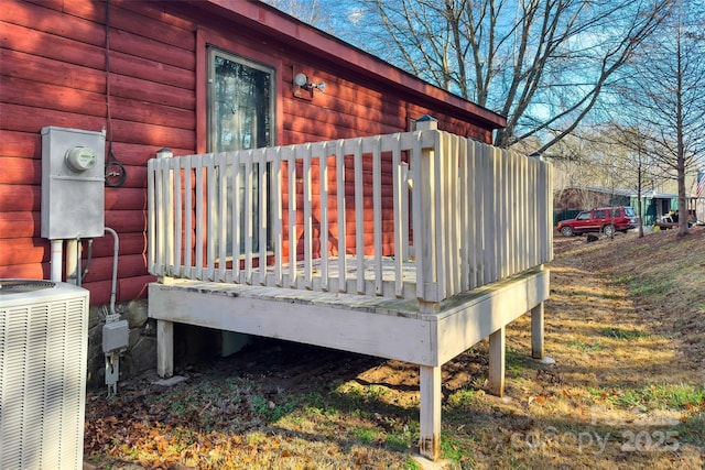 wooden terrace featuring central air condition unit