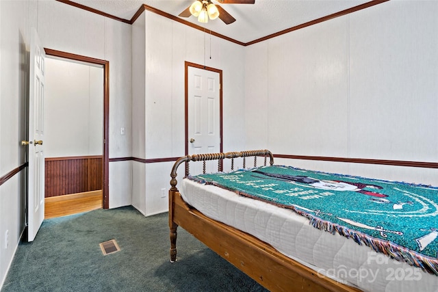 bedroom featuring carpet, ceiling fan, and ornamental molding