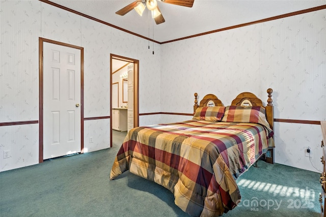 carpeted bedroom featuring a textured ceiling, ceiling fan, ensuite bathroom, and crown molding