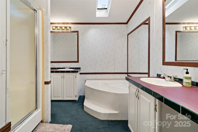 bathroom featuring vanity, plus walk in shower, crown molding, a skylight, and a textured ceiling