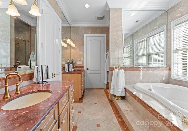 bathroom with vanity, crown molding, and separate shower and tub